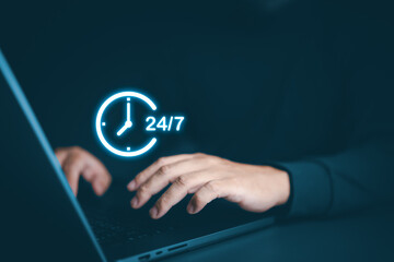 Nonstop worldwide service concept. Businessman uses laptop with virtual 24-7 with a clock for full-time available contact of service concept. Customer service, ready for customer care, contact us.