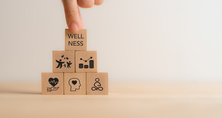 Wellness concept. Wooden cube blocks with health, mindfulness, mental health, happiness, financial...
