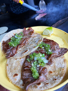 Beef Tacos with green chilli sauce and lime is served at the Taqueria El Califa de Leon stand in Mexico City.