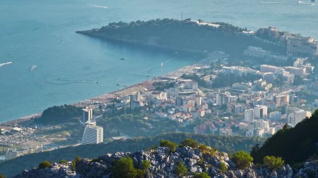Aerial tracking shot of Bečići city from the mountains of Budva, Montenegro