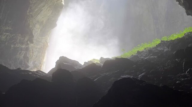 This scene highlights the grandeur of the cave and the contrast between the natural light and the tiny human presence. Prores 4K