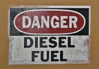 Obraz premium Danger diesel fuel warning sign placard industrial flammable old label.