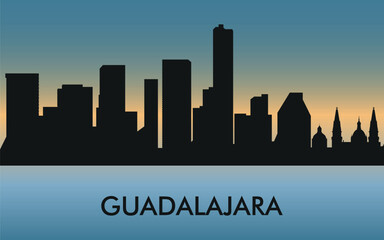 Fototapeta premium Guadalajara. The city skyline. Silhouettes of buildings. The sunset of the day. Vector on a blue background
