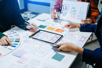  UX developer and ui designer brainstorming about mobile app interface wireframe design with...