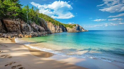 Fototapeta premium The picturesque scene of Acadia National Park's Sand Beach, with its sandy shores and surrounded by rocky cliffs