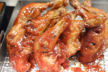 grilled chicken on the grill in the market, closeup of photo