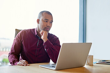 Business man, laptop and reading at startup, thinking and decision for review with planning for project management. Person, computer and ideas with proposal, feedback and choice at creative agency