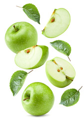 flying green apples with half of apple and green leaves isolated on white background. clipping path