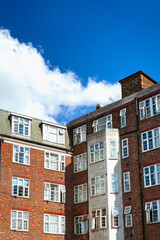 brick houses in the city with a blue sky