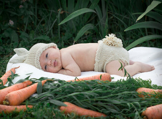 child sleeping on the grass