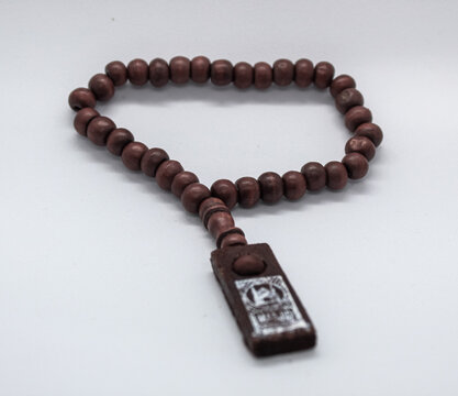 selective focus isolated on white, prayer beads or tasbih made of wood for dhikr or prayer