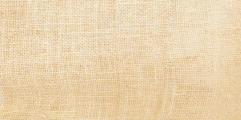 Jute hessian sackcloth canvas woven texture pattern background in light beige cream brown color blank empty