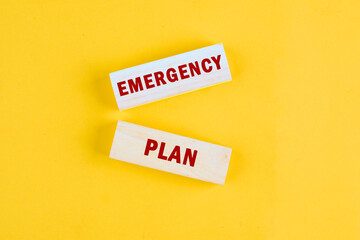 Financial concept. EMERGENCY PLAN text a conceptual phrase on the wooden blocks, top view