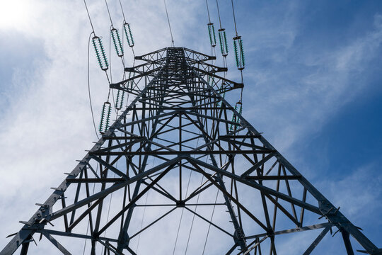 electric pylon blue sky in background