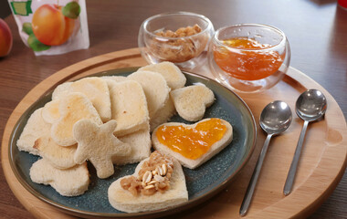 Toasted bread hearts with peanut butter and jam. Breakfast for holidays. Food for good vibe. 