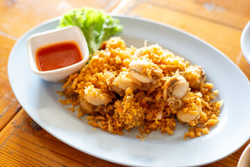 Deep-Fried tiny scallop with crispy garlics and dipping sauce. Seafood recipes popular in local street food.