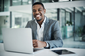 Portrait, business and black man at desk, laptop and entrepreneur with smile, internet and network....