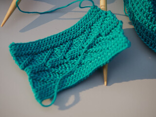 Cozy homely atmosphere. Female hobby knitting and Crochet. Yarn multicolor in a basket. Skeins and balls. Hobby concept.