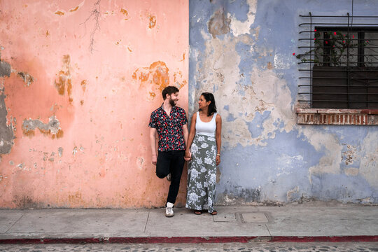Trendy Multi Cultural Couple on a Romantic Walk in Antigua
