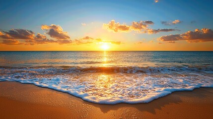 Stunning sunset over tranquil ocean with vibrant colors reflecting on the water, creating a serene beach atmosphere.