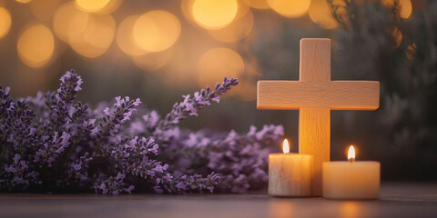 Wooden cross in the night  with  two  candle and lavender flower bunch on the table with bokeh...