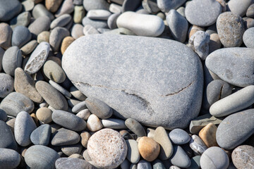 Background texture of sea pebbles, round small stones.