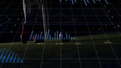 Soccer player kicking ball with financial data charts animation over field - Powered by Adobe