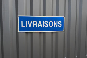 French sign text livraisons means delivery entrance for van truck deliver shop