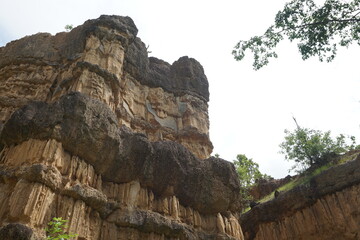 Natural rock formation with a unique and intricate pattern of vertical ridges and grooves, rough texture. Pha Chor, Grand Canyon of Chiang Mai, Thailand. Natural phenomenon