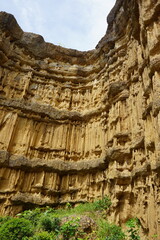 Natural rock formation with a unique and intricate pattern of vertical ridges and grooves, rough texture. Pha Chor, Grand Canyon of Chiang Mai, Thailand. Natural phenomenon