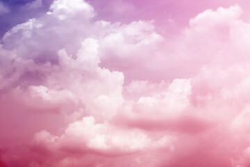 sky with sugar cotton pink pastel clouds in a dreamy background
