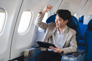 Overjoyed charming excited, Successful business man, Airplane, travel, enjoying comfortable flight while sitting in the airplane cabin.