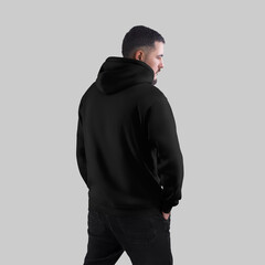 Вlack hoodie mockup, sweatshirt on brutal man, back view, for design, print, pattern, branding.