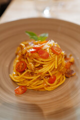 Close up Spaghetti Pomodoro, Tomato based pasta with fresh basil, and Parmesan cheese