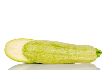 Two halves of ripe zucchini, macro, isolated on white background.