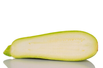 One half of ripe zucchini, macro, isolated on white background.