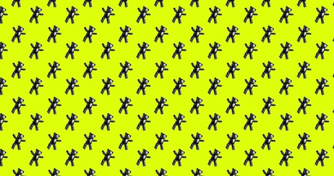 Creative animation pattern. Black latex teddy toy on bright background.
