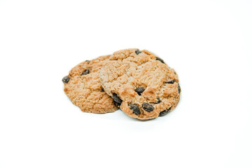 Isolated clipping path of dark chocolate chip cookie on white background. Biscuits with chocolate topping. Cookies isolated on white background