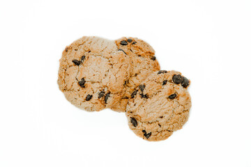 Isolated clipping path of dark chocolate chip cookie on white background. Biscuits with chocolate topping. Cookies isolated on white background