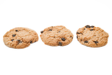 Isolated clipping path of dark chocolate chip cookie on white background. Biscuits with chocolate topping. Cookies isolated on white background