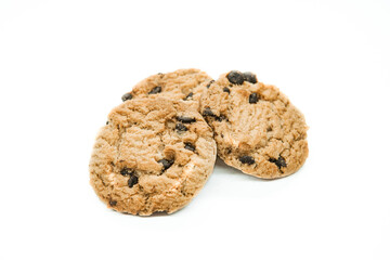 Isolated clipping path of dark chocolate chip cookie on white background. Biscuits with chocolate topping. Cookies isolated on white background