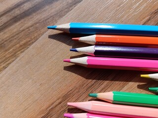 pencils on wooden background, back to school concept 