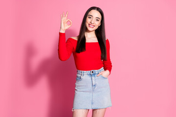 Photo of nice young girl show okey symbol red top isolated on pink color background