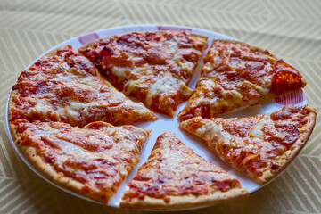 a portioned pizza on a plate ready to be served
