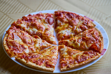 a portioned pizza on a plate ready to be served