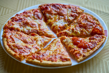 a portioned pizza on a plate ready to be served