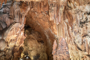 A cave with a large rock formation that looks like a giant mushroom.