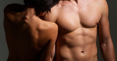 Sexy body. Nude torso of sensual couple. Nude lovers. Passionate touching between muscular man and...