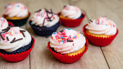 Freshly prepared cupcakes on a background.