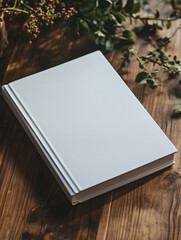  white soft cover book lying on the table, birds eye view